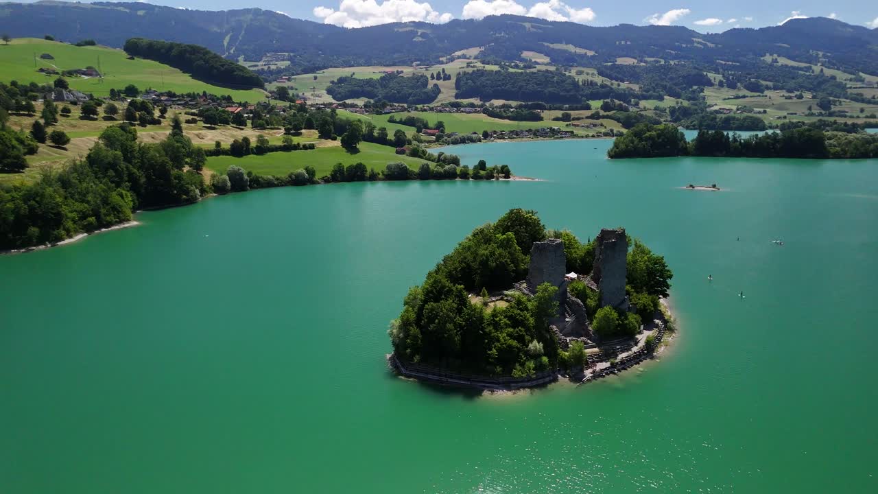Lake Gruyère Le Bry island Switzerland aerial drone ruined castle turquoise blue color landmark