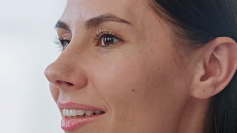 Closeup-woman-face-touching-at-bathroom.-Stunning-lady-preparing-makeup-at-home