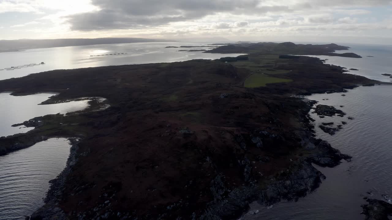 AERIAL - Epic shot of Isle of Gigha at sunrise, Kintyre, Scotland, rising tilt down