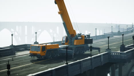 large crane on a bridge in foggy city