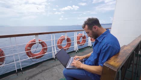 office worker working with laptop on ferry boat.