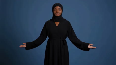 muslim woman meditating or praying with hands raised