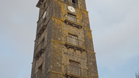 pan up across historic brick tower of iglesia de la concepcion in san cristobal, spain