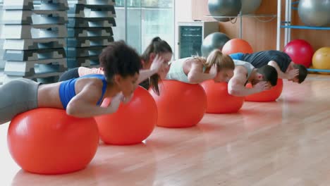 fitness class doing reverse sit ups