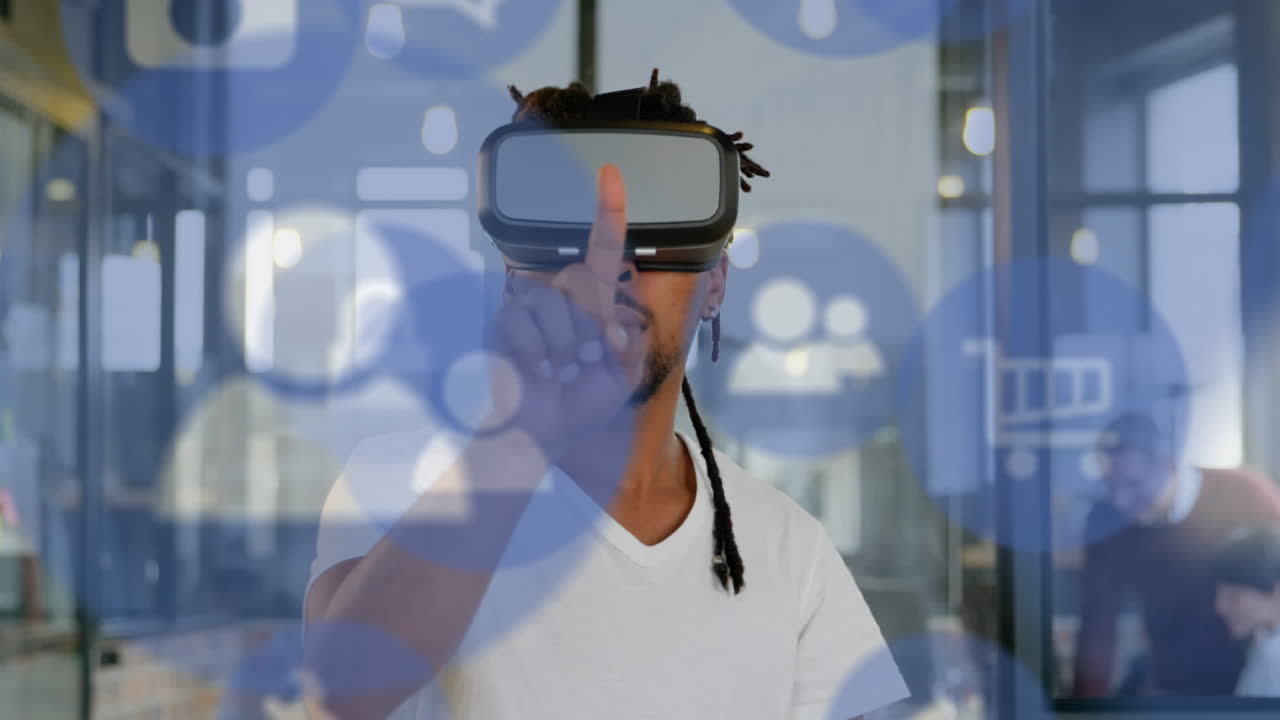 Multiple digital icons floating against african american businessman wearing vr headset at office
