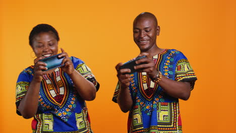 African-american-people-playing-videogames-on-mobile-device