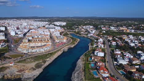 ciutadella de menorca in spain seen from drove vision above the river inlet on clear sky day