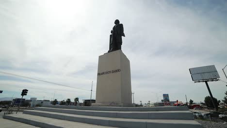low view of a monument statue of the mexican ex-president francisco zarco in a roundabount in the city of mexicali