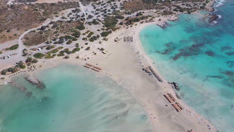 aerial bird view of a paradise beach with umbrellas