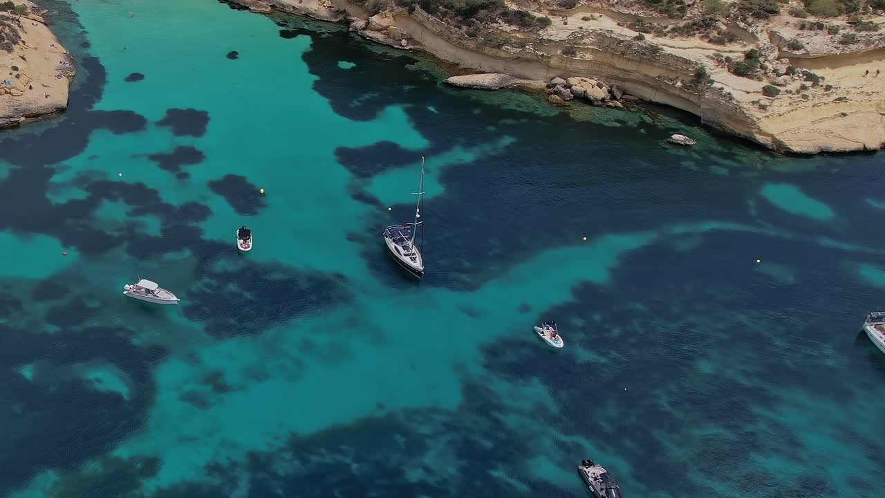 Exploring the clear waters and boats in Mallorca, Spain from above