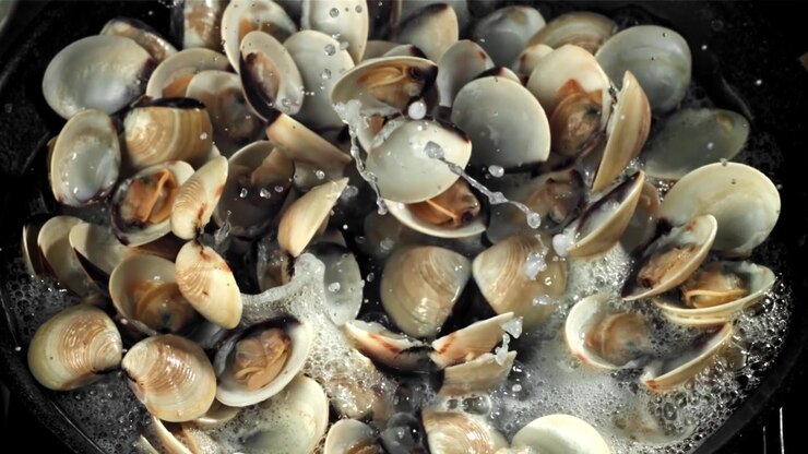 Close-up of Clams Cooking and Opening in Boiling Water