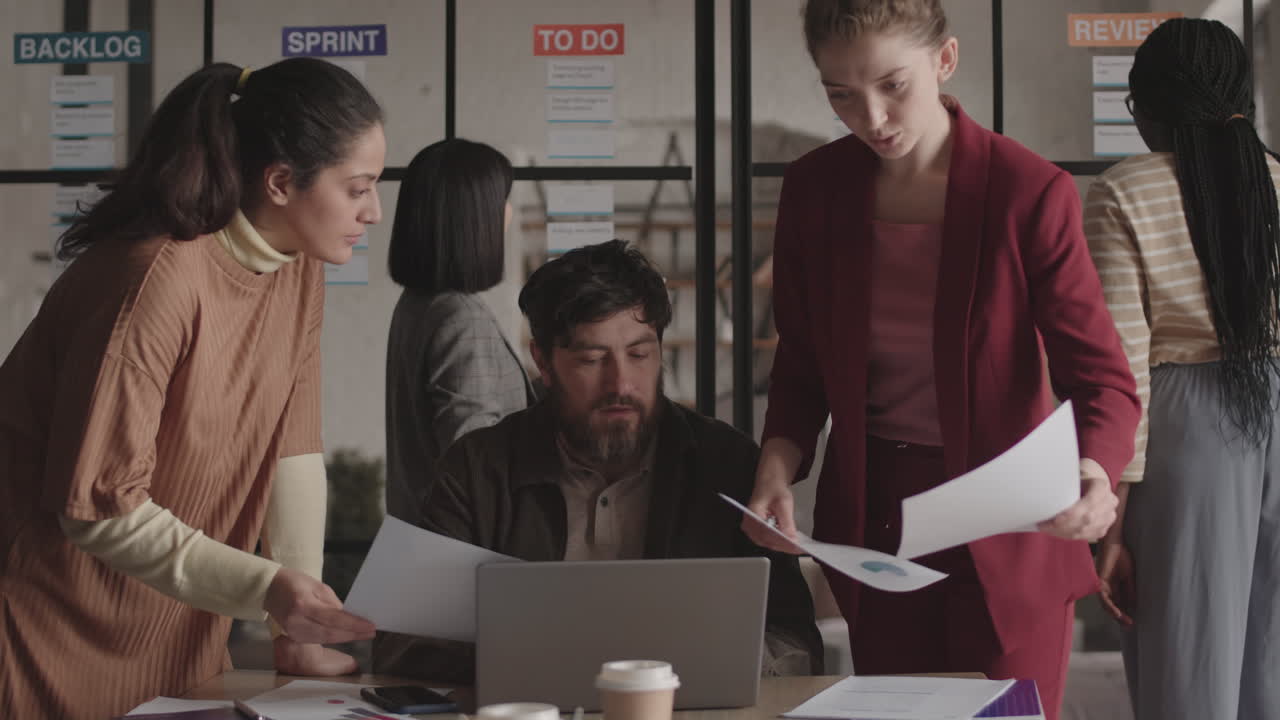 Colleagues Doing Paperwork in Office