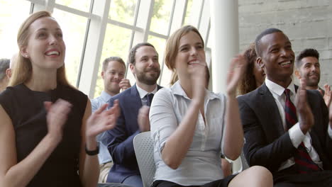 audience applaud speaker at business conference shot on r3d