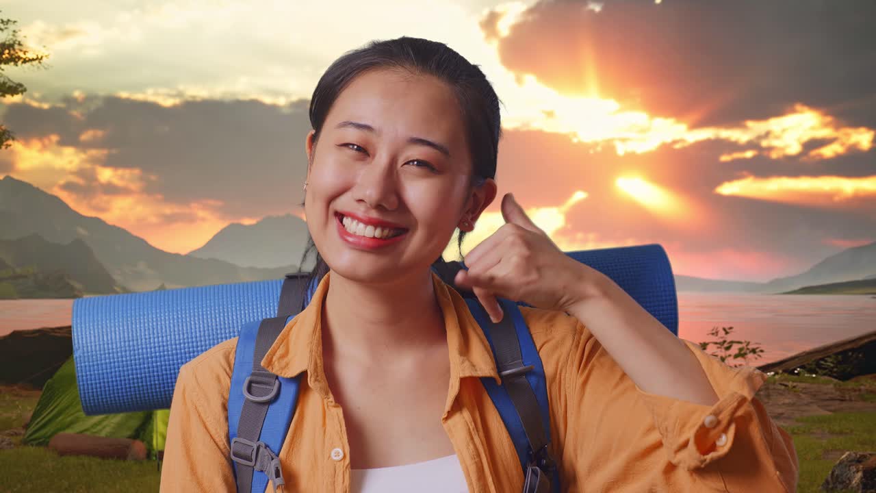 Happy Woman Traveler Gesturing Call at Sunset