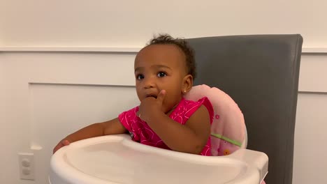 happy baby in high chair