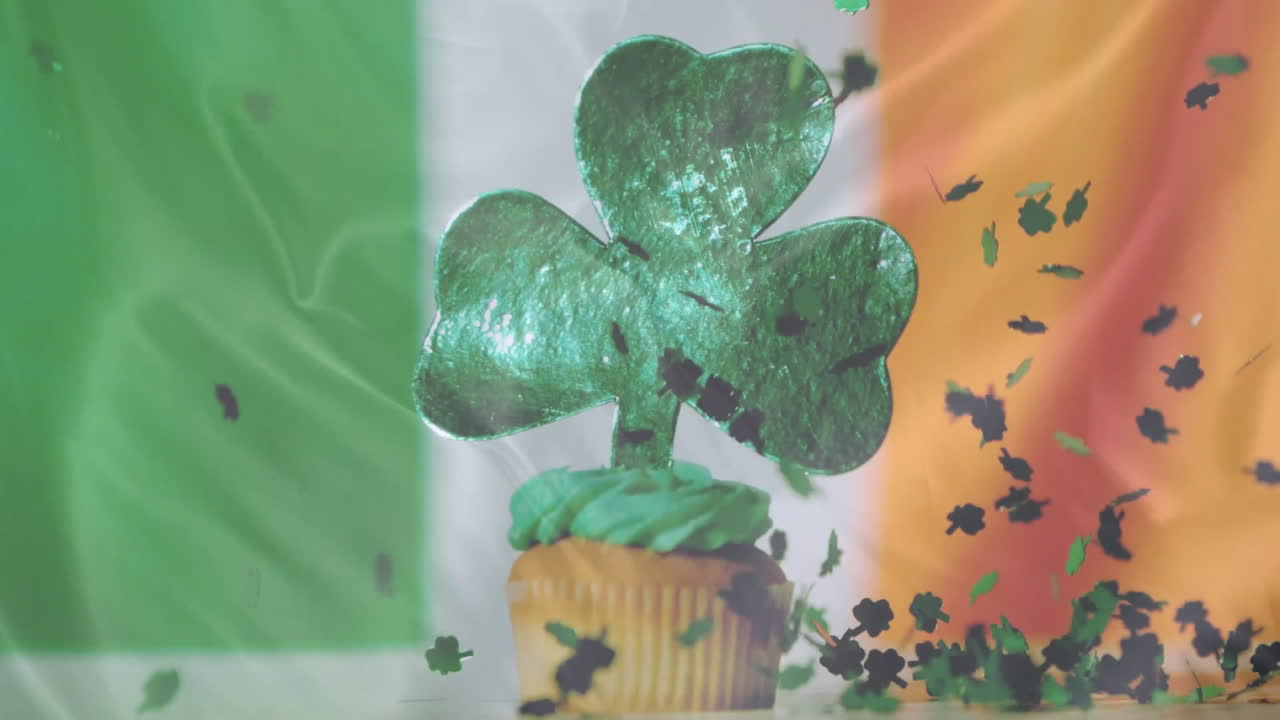 Animation of cupcake with green clover leave and irish flag background