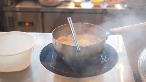 steaming hot pot on an induction cooktop