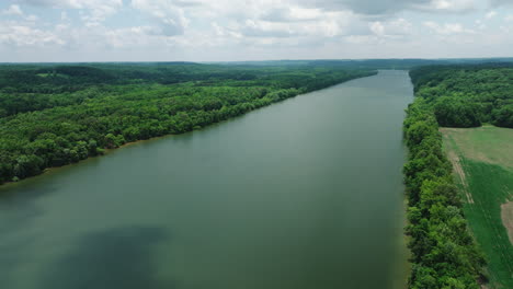 stillness of river in forestland at mousetail landing state park in perry county, tennessee, united states