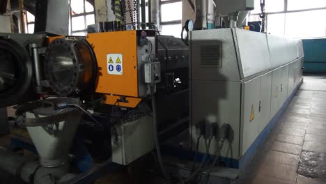 plastic extrusion machine in a factory