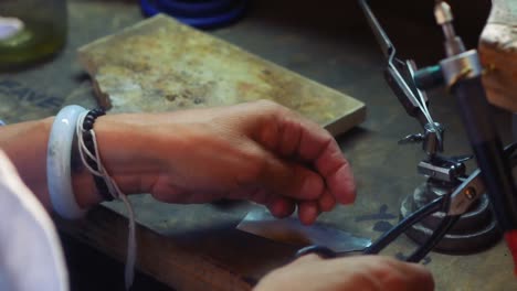 Craftswoman-working-in-workshop