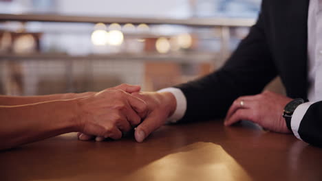 couple holding hands during a date