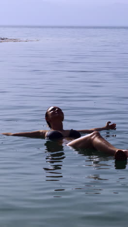 woman floating in the dead sea