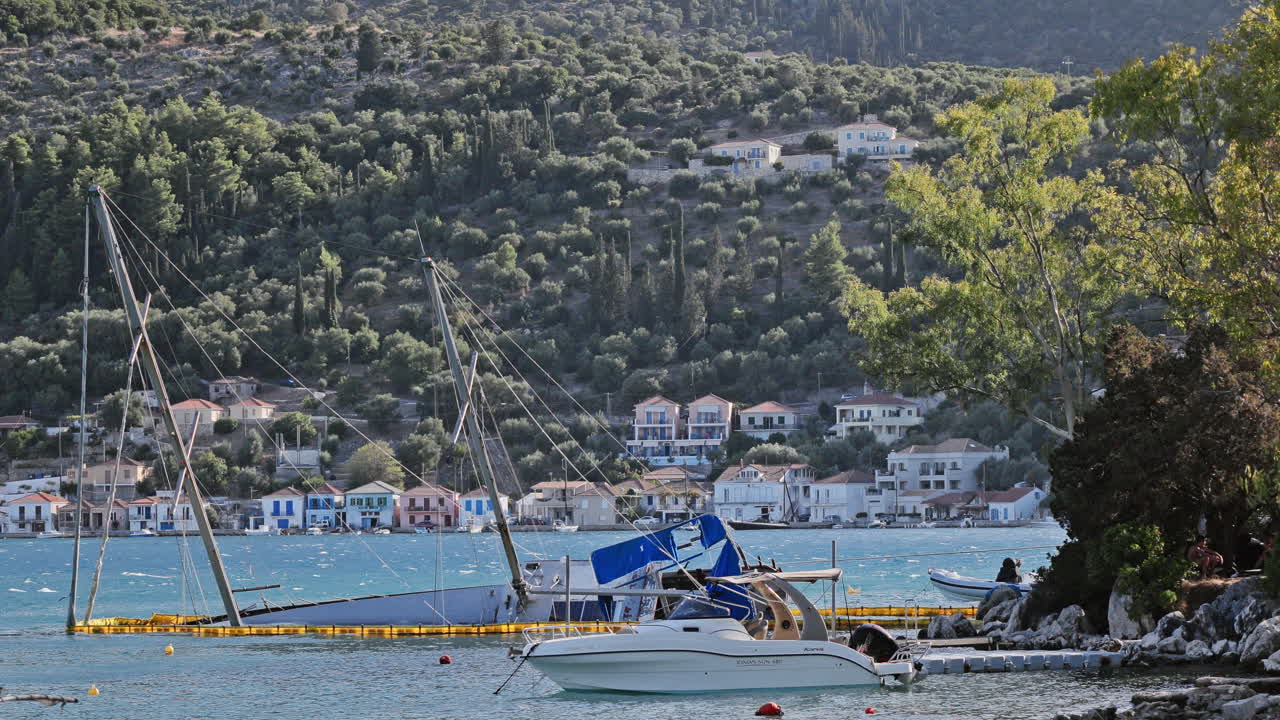 sunken yacht on the rocky coast in ithaca, greece