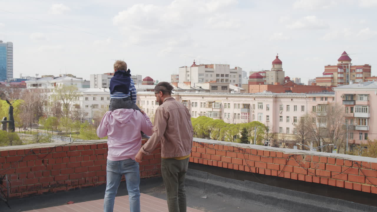 Gay Fathers and Little Son Standing on Roof