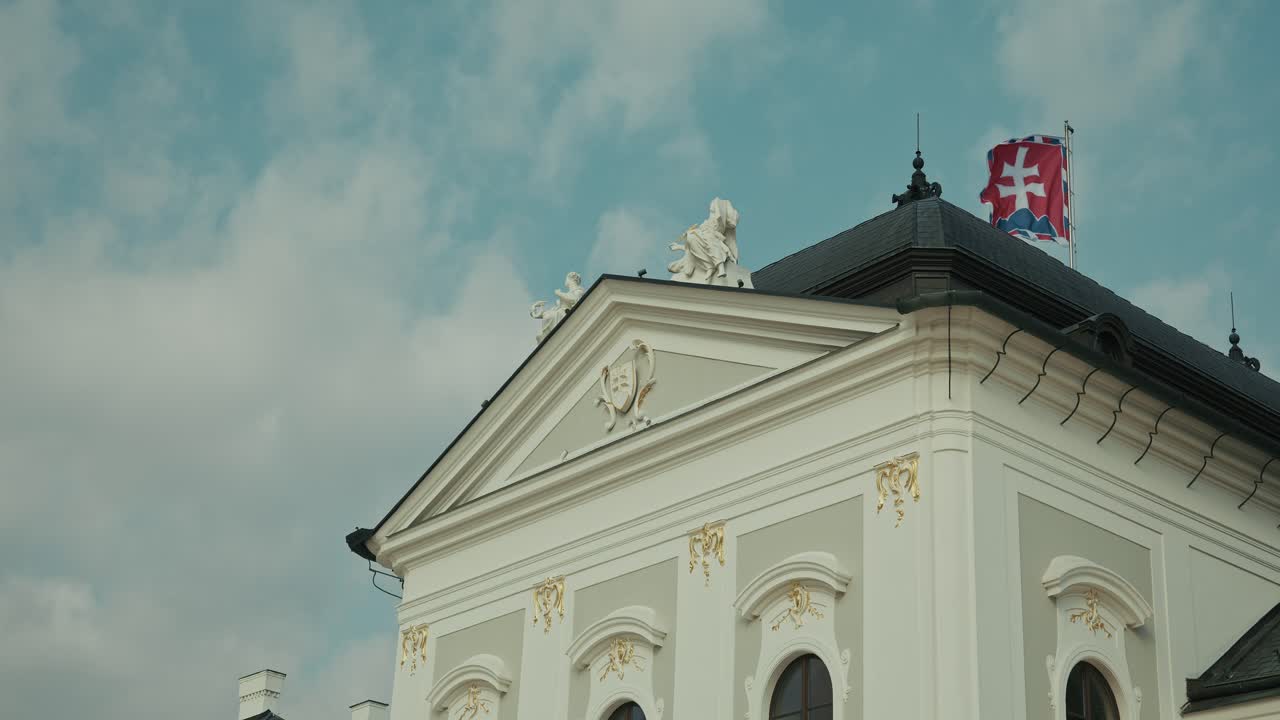 Elegant facade of the Presidential Palace in Bratislava Slovakia with national flag