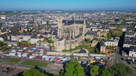 panoramic drone cityscape view of le mans with cathedral of saint julian of le mans at distant horizon, le mans, france.