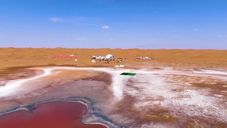 Flyover-aerial-view-of-the-famous-pink-and-heart-shaped-Wulan-Lake-in-the-Tengger-Desert,-Inner-Mongolia-Autonomous-Region,-China