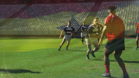 animation of flag of ghana over diverse male rugby players playing at stadium