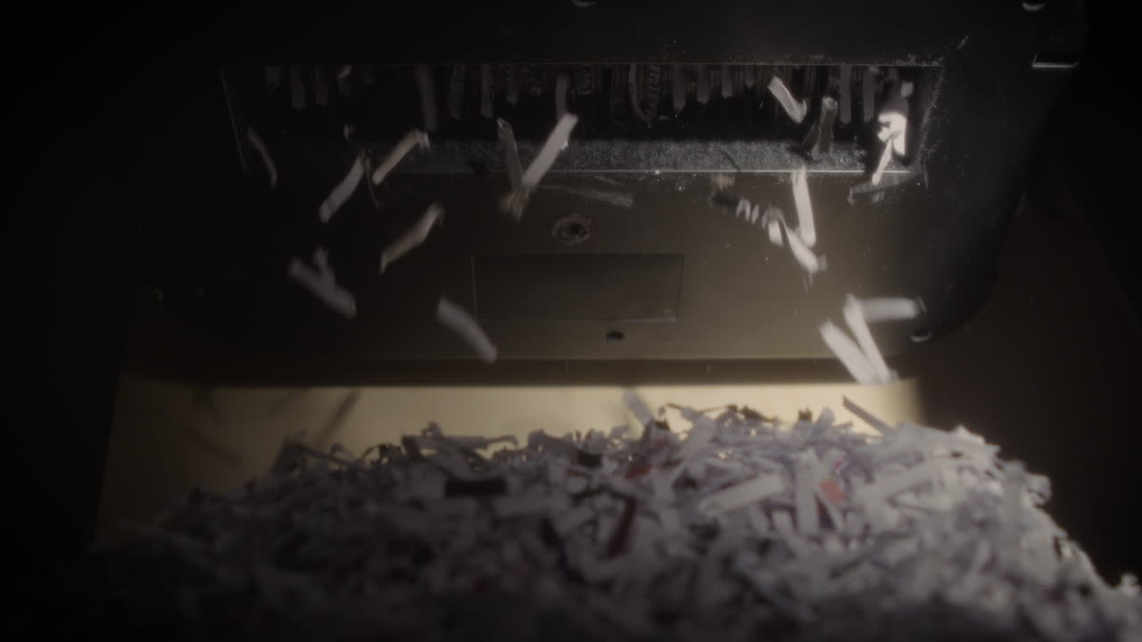 Shredder Cutting Paper From Below In Slow Motion, Half-Full Basket, Hard Light, Soft Net Filter