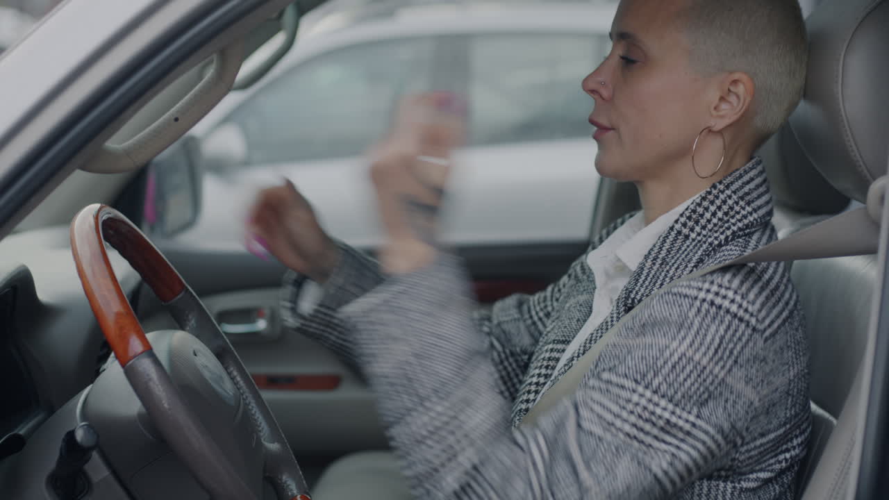 Woman Adjusting Seatbelt in Car