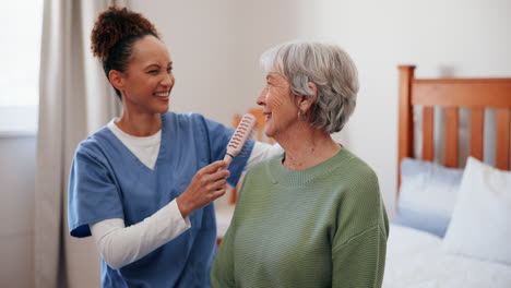 caregiver assisting senior woman with hair brushing