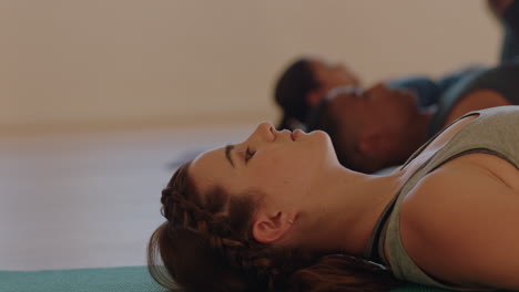 yoga class young caucasian woman practicing plow pose enjoying exercising in fitness studio at sunrise