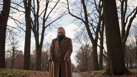 elderly woman walking in a park