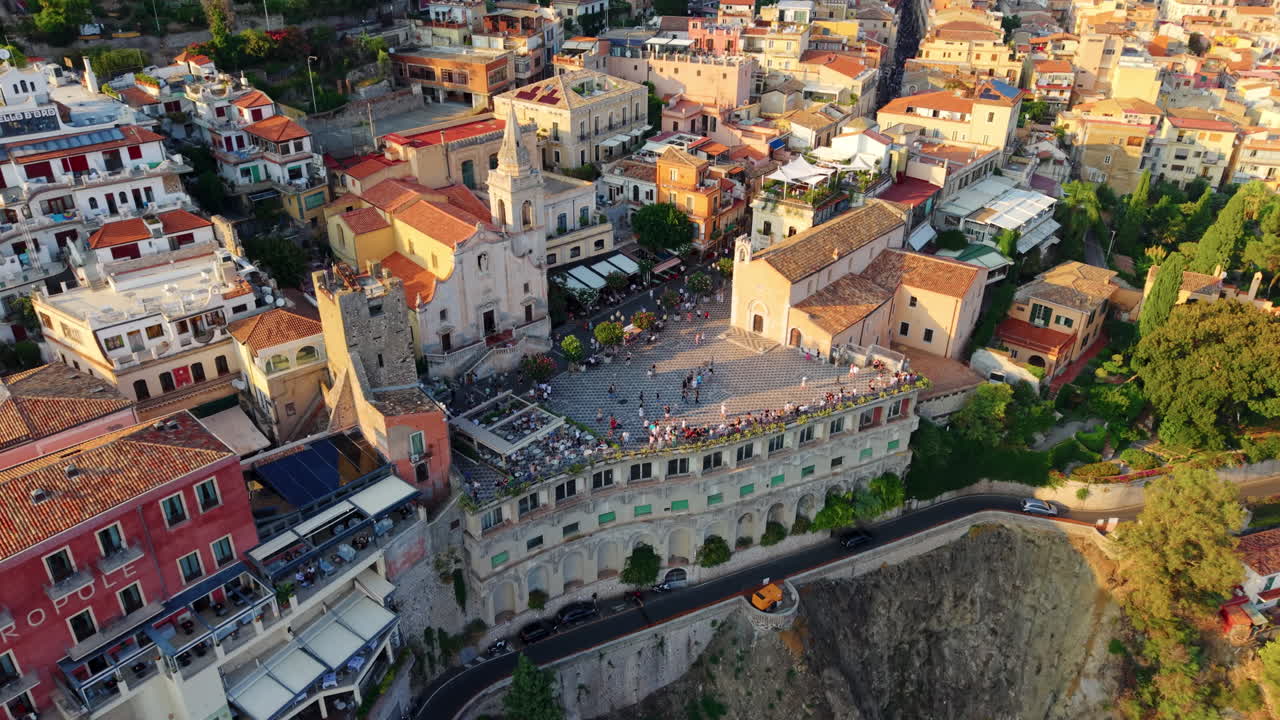 Aerial view of Taormina, Sicily, vibrant buildings, and sea view