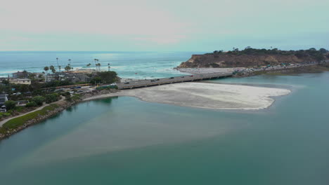 Traffic-Driving-On-Bridge-Over-San-Dieguito-River-With-North-Bluff-Preserve-In-Del-Mar,-San-Diego,-California,-USA