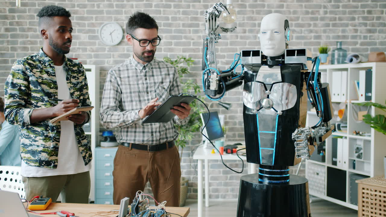 Engineers Working with a Robot Prototype