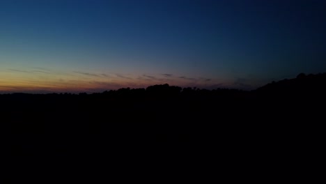 late afternoon sky turning to sunset over south downs way in sussex, england