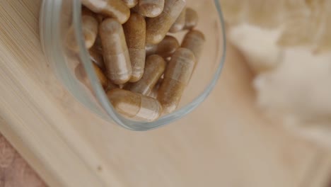 close-up of herbal capsules in a glass container