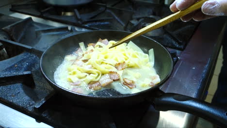 pasta carbonara cooking on pan