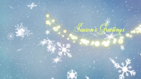 animation of seasons greetings text and fairy lights over snowflakes falling against blue background