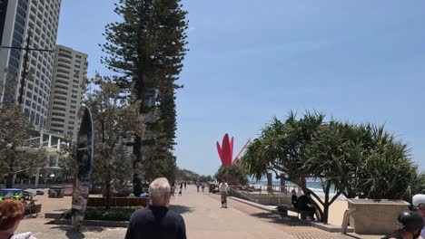 people enjoying a leisurely walk by the sea