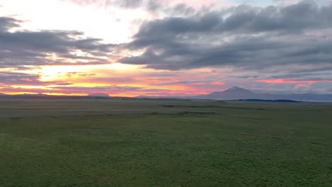 south iceland - sunrise above hekla volcano - drone flying forward