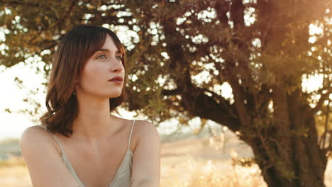 model posing under a tree