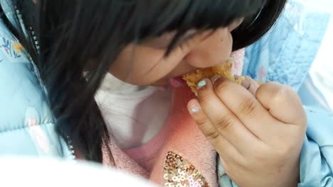 girl eating fried chicken