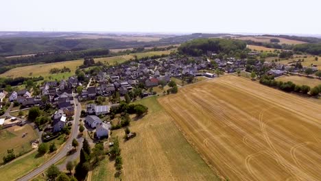 flight with a dji phantom 4 drone around a rural, german village located in rural, agricultural area