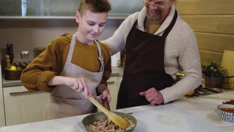 boy cooking meat